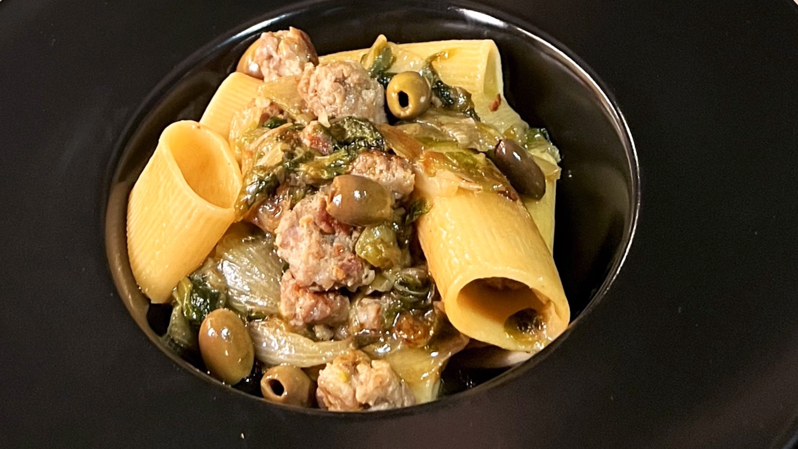 Paccheri with sausage, scarola and olives