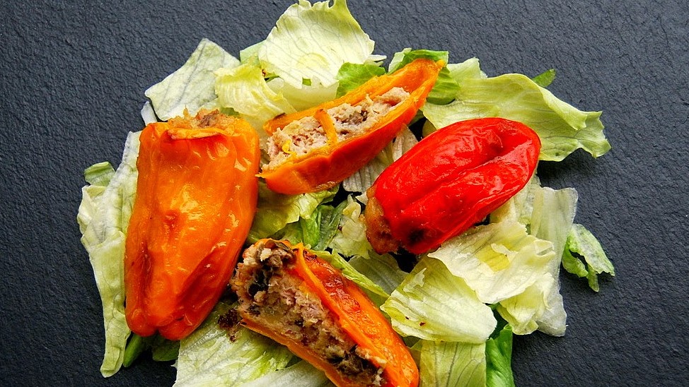 Sweet peppers stuffed with tuna and capers with iceberg salad