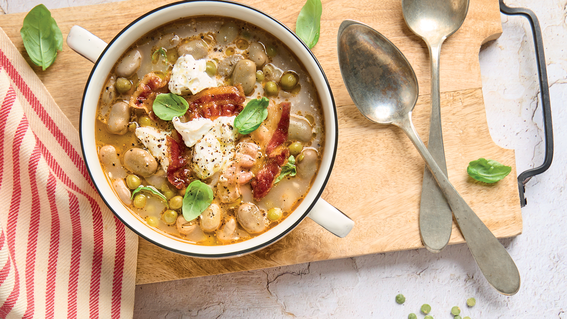 Fava beans and peas soup with burrata and crispy bacon
