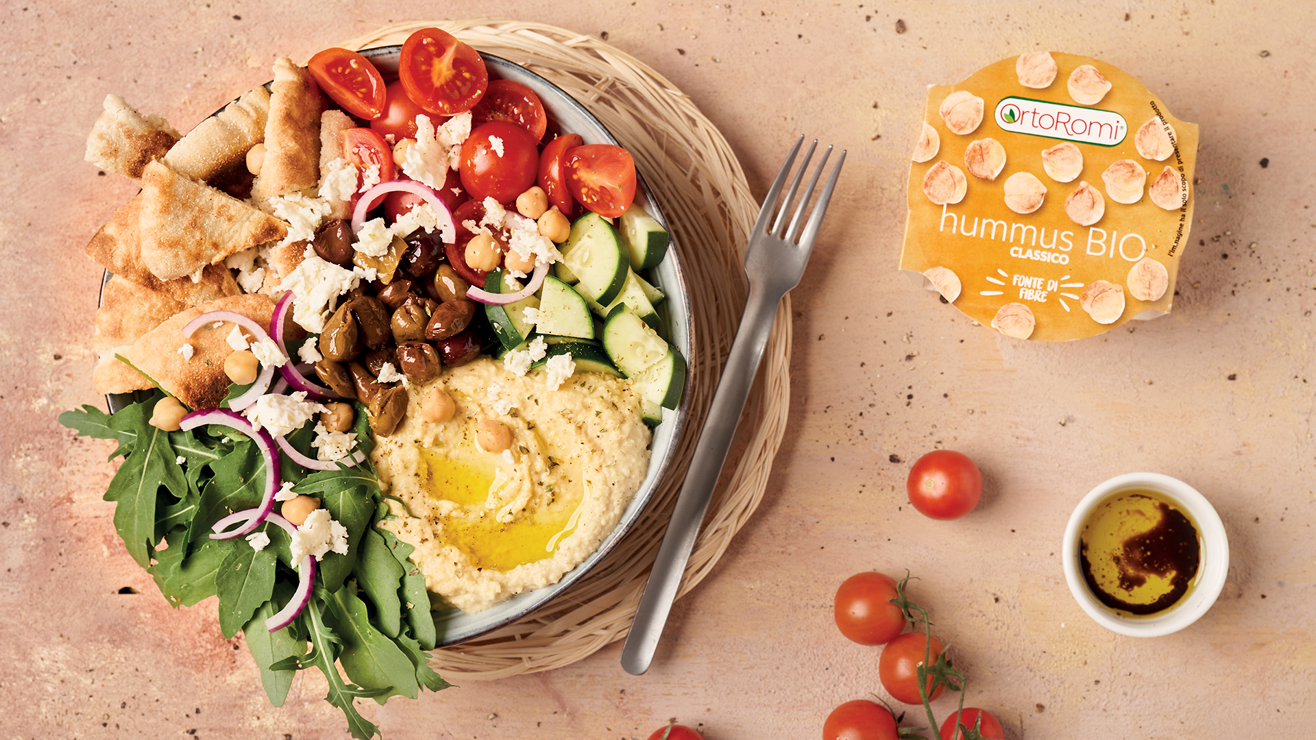 Summer bowl with vegetables, pita bread, feta cheese and hummus